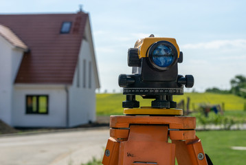 construction site - measurements with a theodolite leveling device