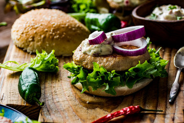 Chicken burgers with fresh salad, onion, peppers and mayonnaise sauce