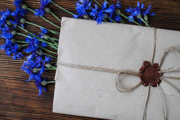 Envelope and blue flowers
