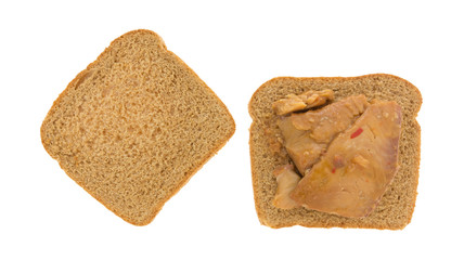 Open face tilapia fillet in sesame sauce sandwich isolated on a white background.