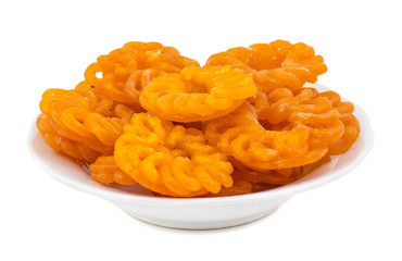 Indian Sweet Food Imarti Also Know as Amriti, Omriti, Jahangir, Jalebi, Jaangiri. It is Mde by Deep-Frying Vigna Mungo Flour Batter in a Kind of Circular Flower Shape. isolated on white Background