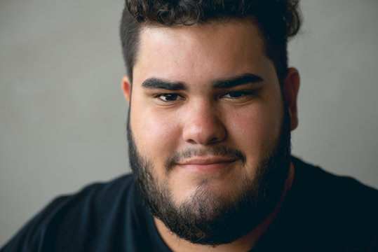  Close-up portrait of confident young millennial smiling