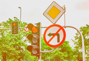 Road signs, the traffic light is red, the turn to the left is forbidden