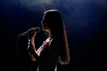 Shadow of singer in light