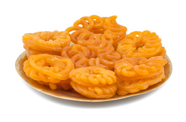 Indian Sweet Food Imarti Also Know as Amriti, Omriti, Jahangir, Jalebi, Jaangiri. It is Mde by Deep-Frying Vigna Mungo Flour Batter in a Kind of Circular Flower Shape. isolated on white Background