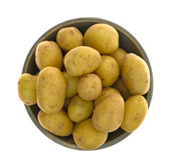 Top view of baby potatoes in a bowl isolated on a white background.
