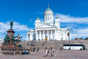 Helsinki. Senate square. Tourists take pictures of the Cathedral.