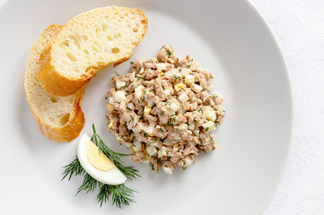 cod liver salad, egg on dill, and white bread slices