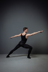 Adult perspective dancer training and improving ballet movements.
