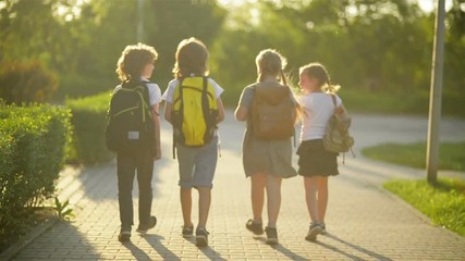 Four Friends Are Going to School. They Have A Lot of Fun Because Today is Their First Day at School. - Powered by Adobe
