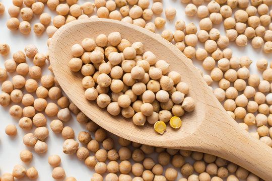dry raw chickpeas in a spoon