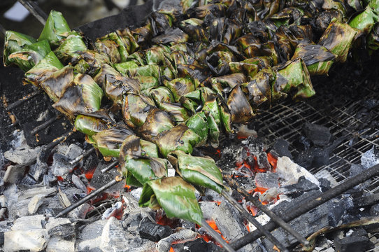 Satar or sata is an exotic food very popular in peninsular Malaysia. It is made of raw fish and coconut, wrapped in fresh banana leaf. It has to be roasted before served.