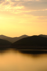Landscape of mountains and water,sunset light,boat floating