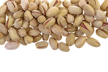 pile of pistachios on a white background