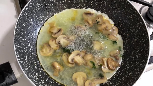 Time lapse of omelette made with mushrooms and only albumen or white egg.