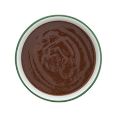 Top view of pulled pork starter sauce in a bowl isolated on a white background.