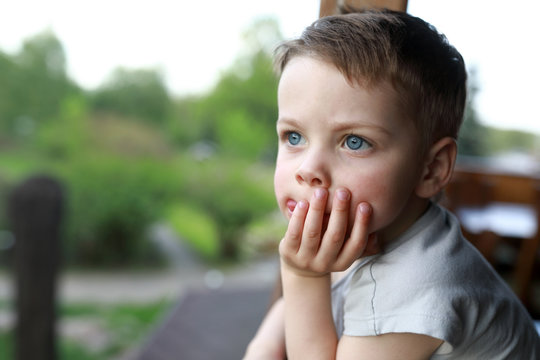 Thinking boy at terrace