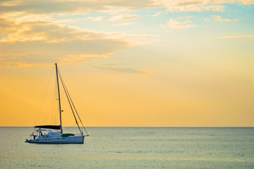 Sailing boat on a background of a beautiful sunset