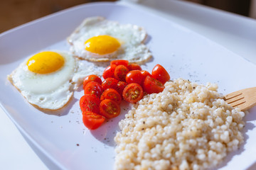 Eggs, tomatoes and couscous for dinner