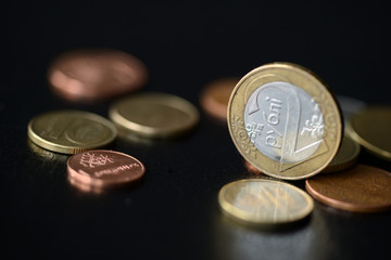 Belarusian coins scattered on a dark surface close up