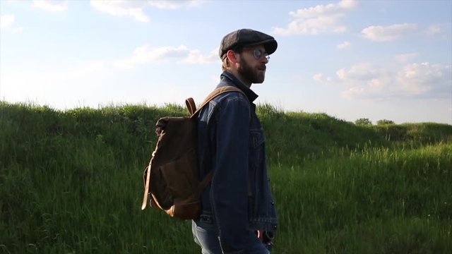 Traveler Walking a Hills. Hipster Walking on fields