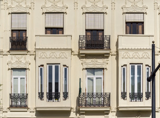 Architecture of Classical Building Facade on Old Historical House. Exterior of White Color Apartment Building Front View. Minimalist European Style Architecture on Sunny Day.