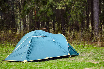 Camping. Tourist tent in the forest