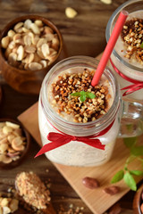 Protein cocktail with peanuts in a glass jar