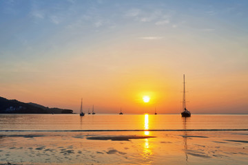 Yacht in the sea at sunset