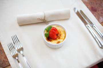 cream brulee with strawberry and mint
