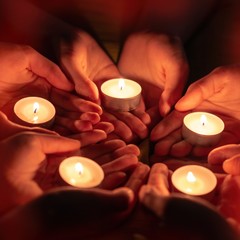 prayer with candles in hands