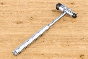 Reflex hammer on the wooden table, 3D rendering