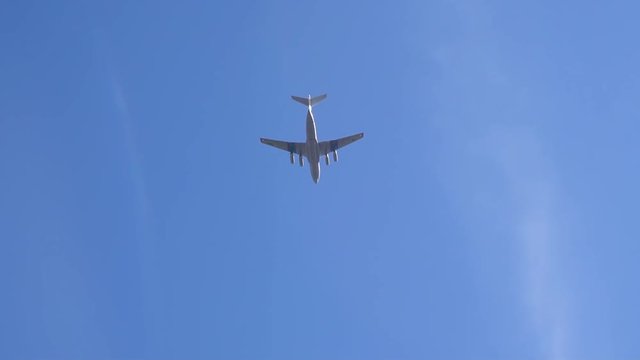 large plane in the blue sky over Moscow slow motion video