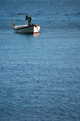 Small empty fisherman boat on a lake