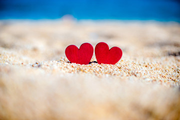romantic symbol of two hearts on the beach 
