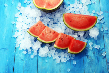 watermelon on blue background. juicy summer fruit in slices