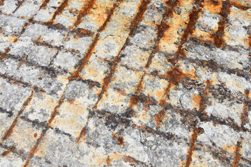 Rough weathered rusty surface of reinforced concrete floor