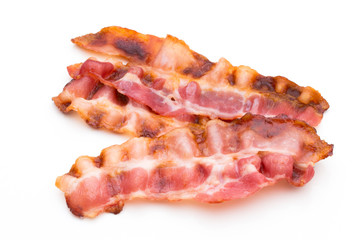 Obraz premium Cooked bacon rashers isolated on white.