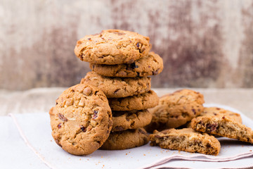 Chocolate oatmeal cookies on the wooden background.