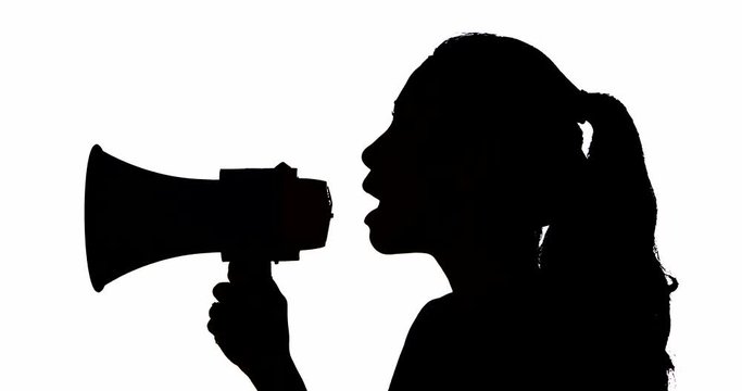 Silhouette of young woman shouting on the megaphone in the studio, isolated on white background. Shot in 4k resolution