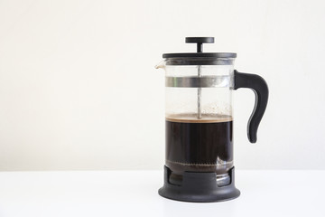 A classic French press in a isolated background, coffee