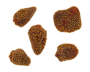 Top view of several dried strawberries on a white background.
