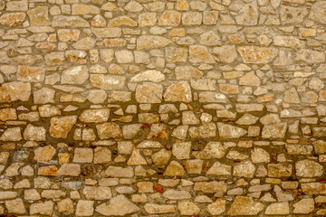 Fragment of an old limestone wall
