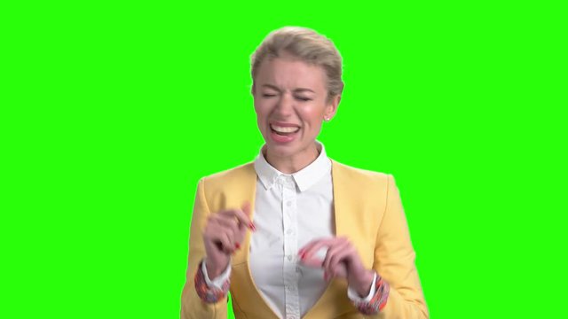 Charming lady is singing on green screen. Cute woman is singing and dancing on alpha channel background. Enjoy of music.