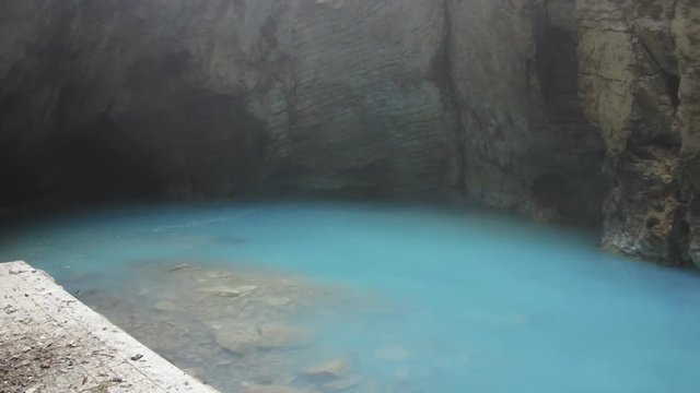 Natural underground karst mineral lake Proval with pure blue water in Pyatigorsk.