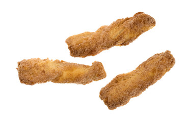 Top view of a group of crunchy baked twisted cookies isolated on a white background.