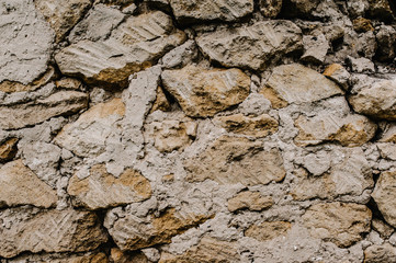 Background, texture, stone..Abstract texture grunge old wall.Brown grunge wall - Great textures for design.Stone wall. Background of large concrete bricks. Big pile of stones as a background