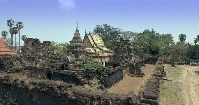  Aerial drone shot : fly over an  old temple made of sandstone and laterite. It was built long before the legendary Angkor Wat temple in Siem Reap, but it was created in a similar style. Cambodia