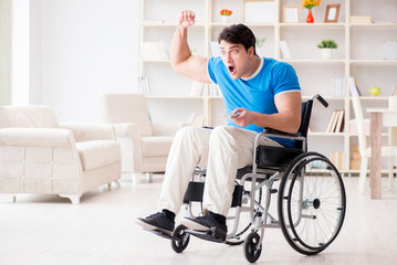 Fototapeta premium Disabled man watching sports on tv