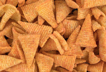 Cheese flavored cone shaped corn chips.